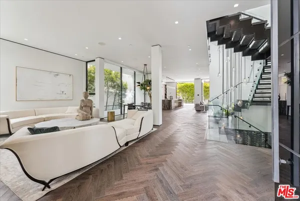 a lobby with furniture and a potted plant