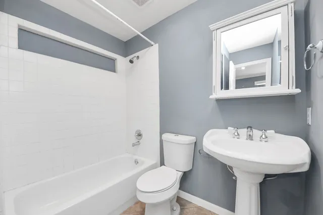 a bathroom with a sink a toilet and a bathtub