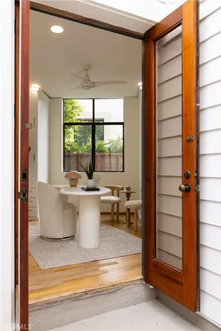 a view of living room with a large window and chandelier