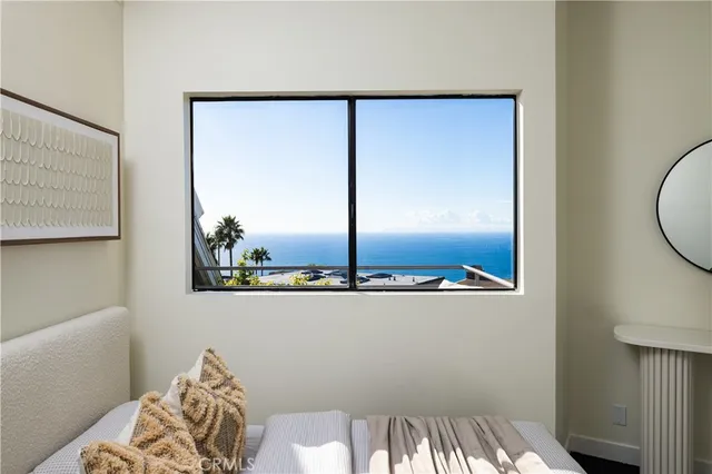 a view of a room with furniture and window