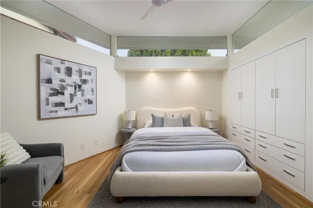 a bedroom with a bed and a couch