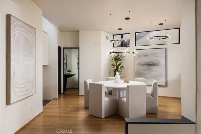 a view of a kitchen with appliances and furniture