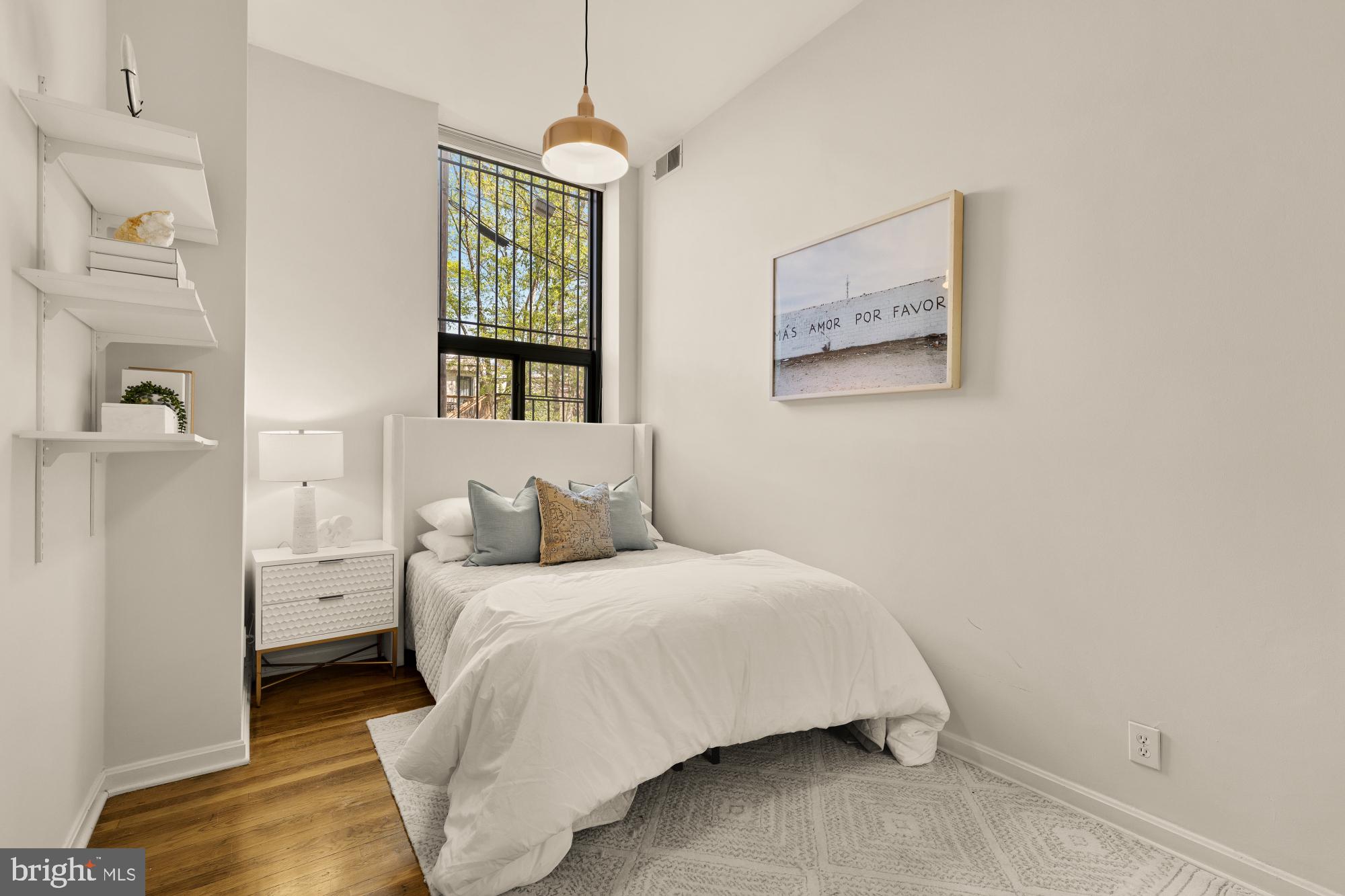 1715 15th Street Northwest, Unit 101 Washington, DC 20009 - Photo 10 of 24 a bedroom with a bed and a window