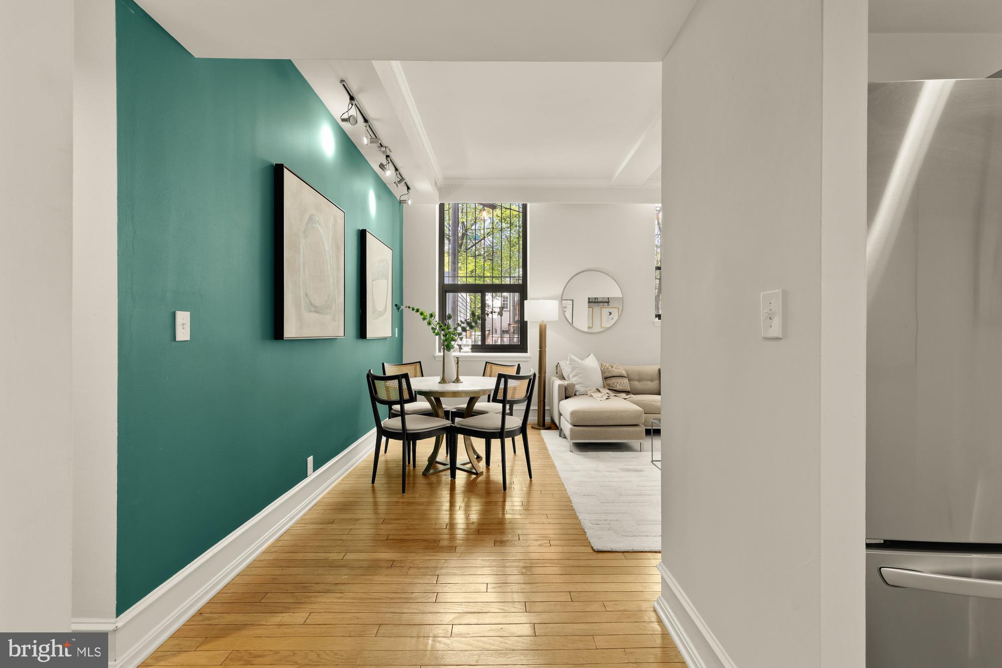 1715 15th Street Northwest, Unit 101 Washington, DC 20009 - Photo 2 of 24 a view of a dining room with furniture and a window