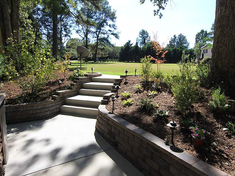 5328 Edington Lane Raleigh, NC 27604 - Photo 17 of 25 Stairs leading to the back yard from the patio. Yard