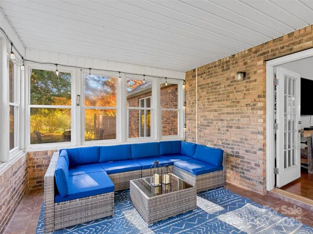 a living room with furniture and a rug