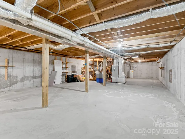 a view of empty room with wooden walls