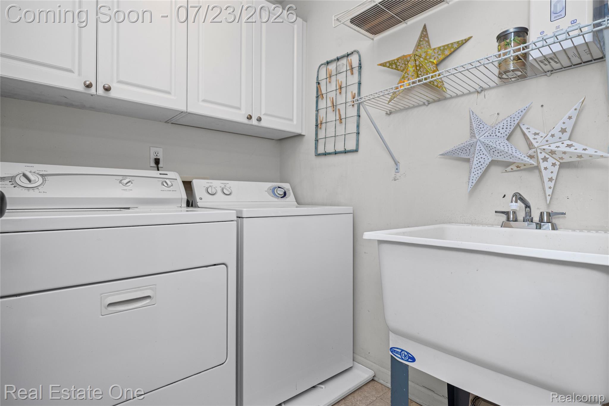 3570 Tremonte Circle, Unit 282 Rochester, MI 48306 - Photo 24 of 44 Convenient laundry with cabinetry, washer and dryer included. Bonus utility sink.