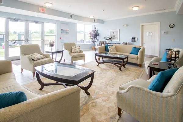 a living room with furniture and a table