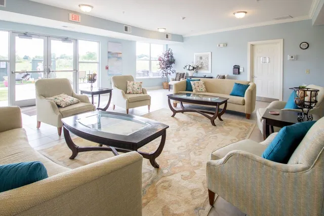 a living room with furniture and a table
