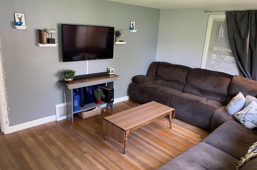 15 Bainridge Road Worcester, MA 01602 - Photo 3 of 40 a living room with furniture and a flat screen tv