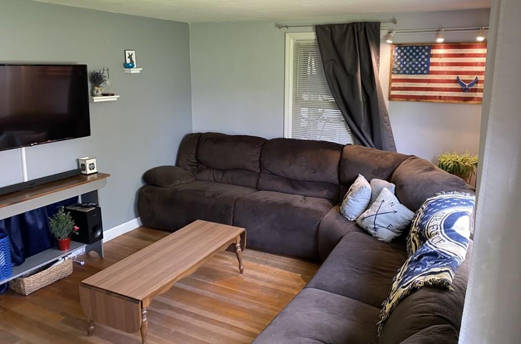 15 Bainridge Road Worcester, MA 01602 - Photo 4 of 40 a living room with furniture and a flat screen tv