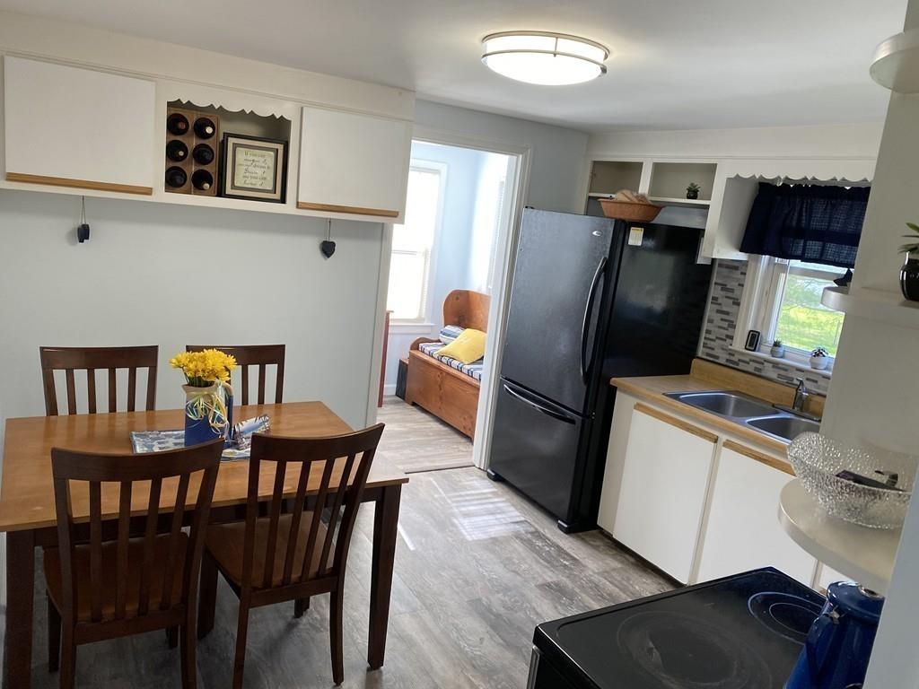 15 Bainridge Road Worcester, MA 01602 - Photo 8 of 40 a dining room with furniture and a refrigerator