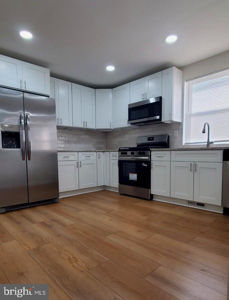102 West Clements Bridge Road Runnemede, NJ 08078 - Photo 4 of 20 Modern kitchen with sleek finishes.