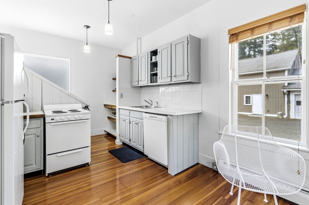 58 Front Street Northampton, MA 01053 - Photo 33 of 42 a kitchen with a stove a sink and a refrigerator