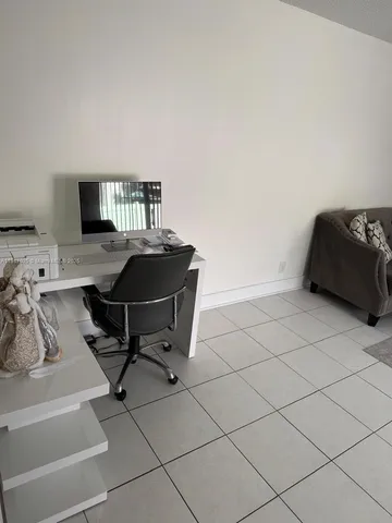 a kitchen with kitchen island stainless steel appliances a sink and a counter top space