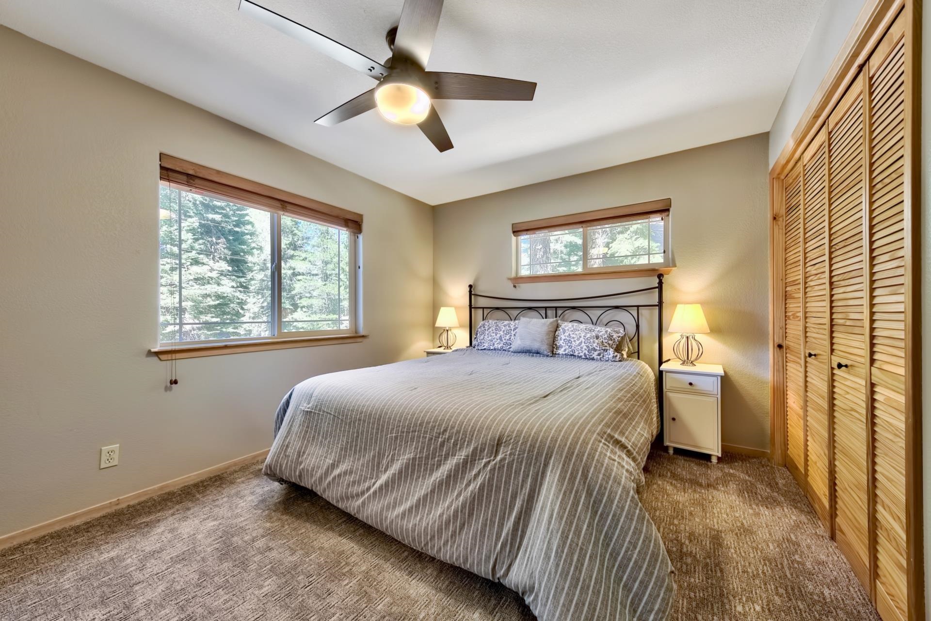 10501 Heather Road Truckee, CA 96161 - Photo 14 of 21 a bedroom with a large bed and a window