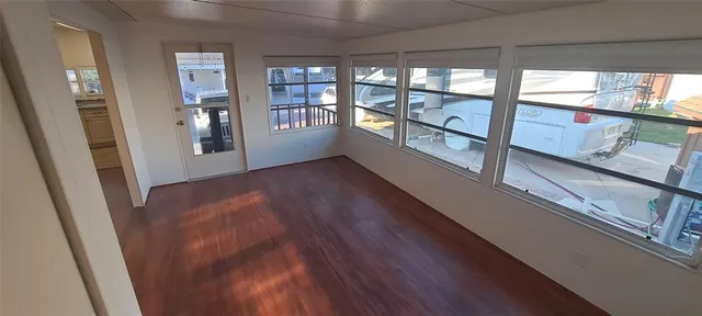 a view of an entryway with wooden floor