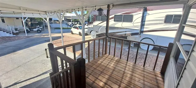 a view of staircase with railing and white walls