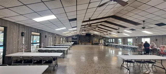 a view of a porch with furniture and a chandelier