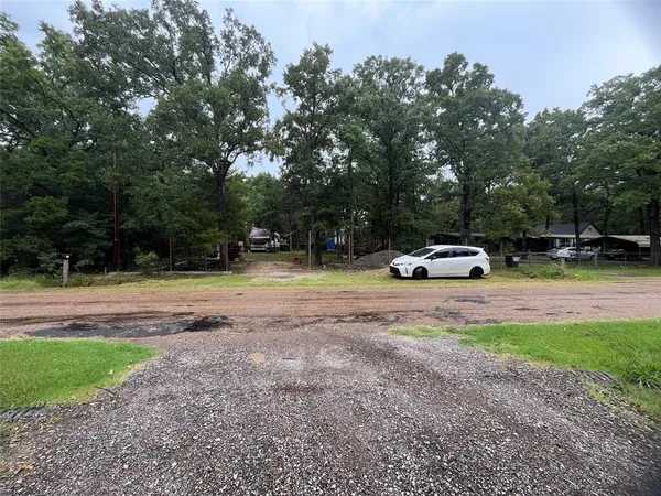 a swimming pool with a bench and trees