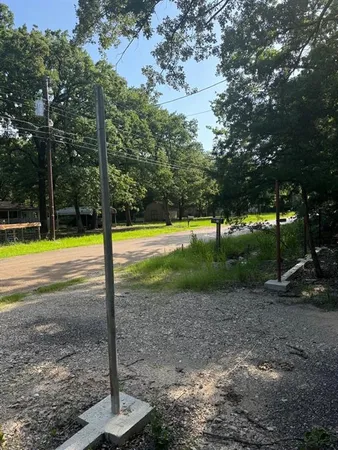 a view of a wooden fence with a bench