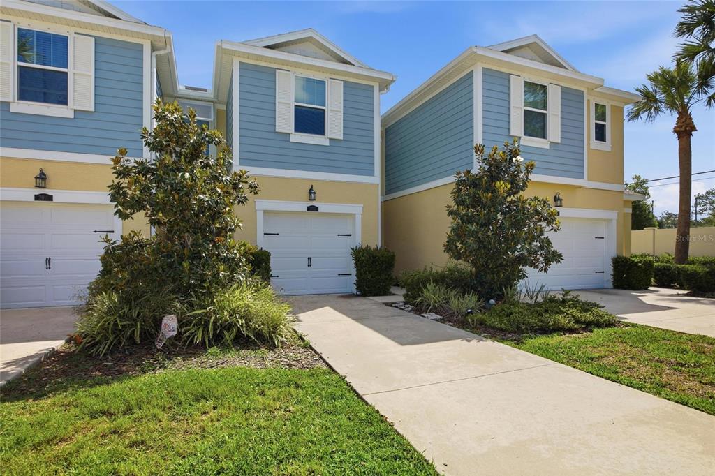 2013 Sunset Wind Loop Oldsmar, FL 34677 - Photo 2 of 43 a front view of a house with garden