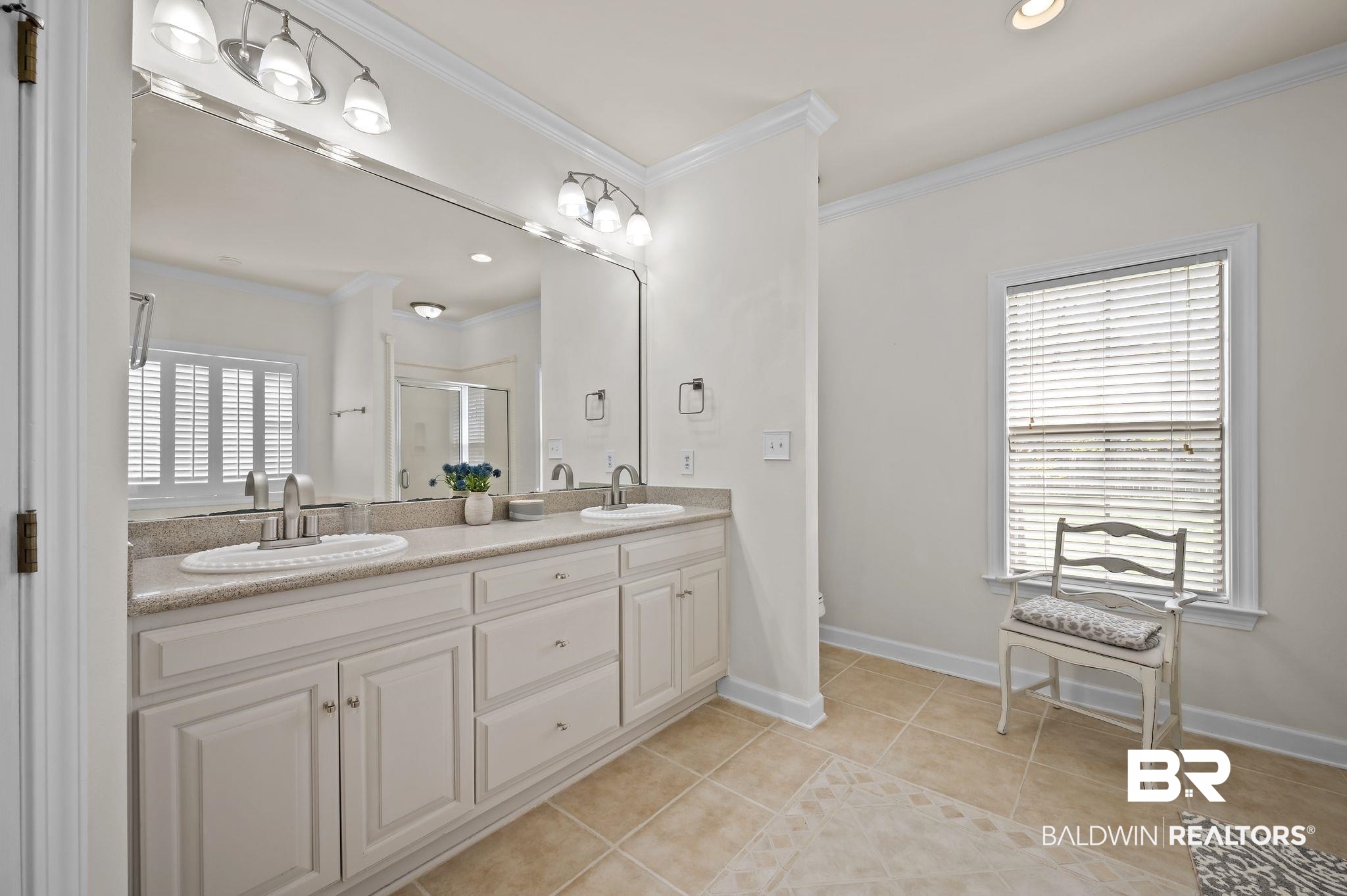 9837 Harmony Ridge Drive Semmes, AL 36575 - Photo 21 of 29 Bathroom featuring tile patterned flooring, a sink, crown molding, and a shower stall