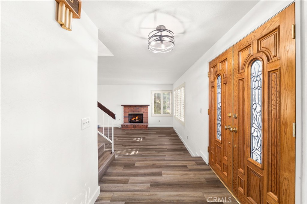 162 Lakeside Avenue Redlands, CA 92373 - Photo 14 of 32 a view of entryway and hall with wooden floor