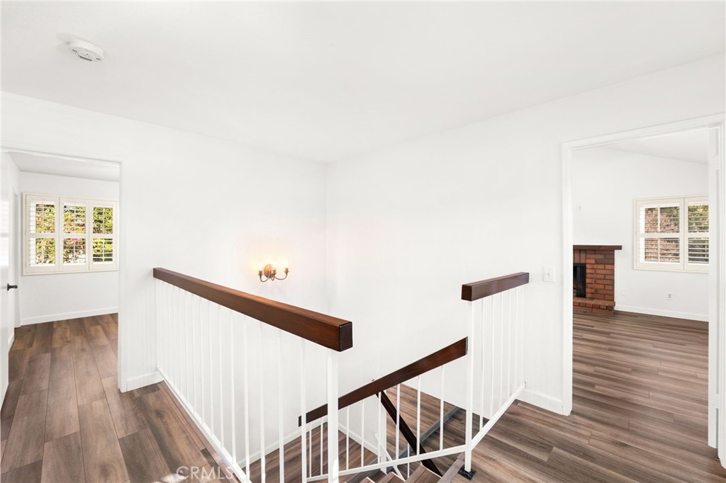 162 Lakeside Avenue Redlands, CA 92373 - Photo 15 of 32 a view of a hallway with wooden floor and staircase