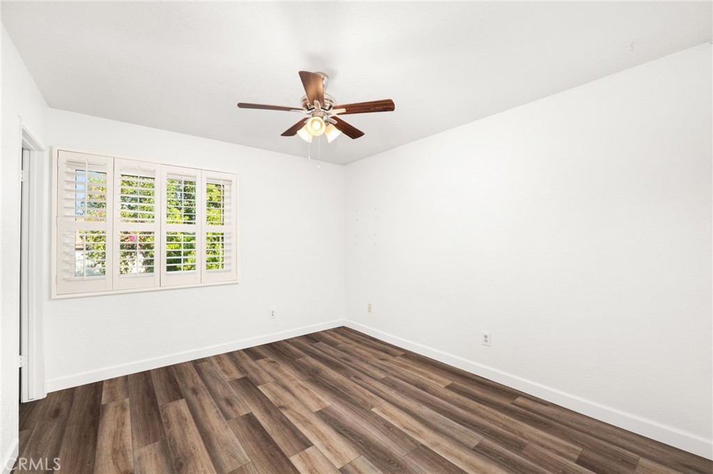 162 Lakeside Avenue Redlands, CA 92373 - Photo 18 of 32 a view of empty room with wooden floor and fan