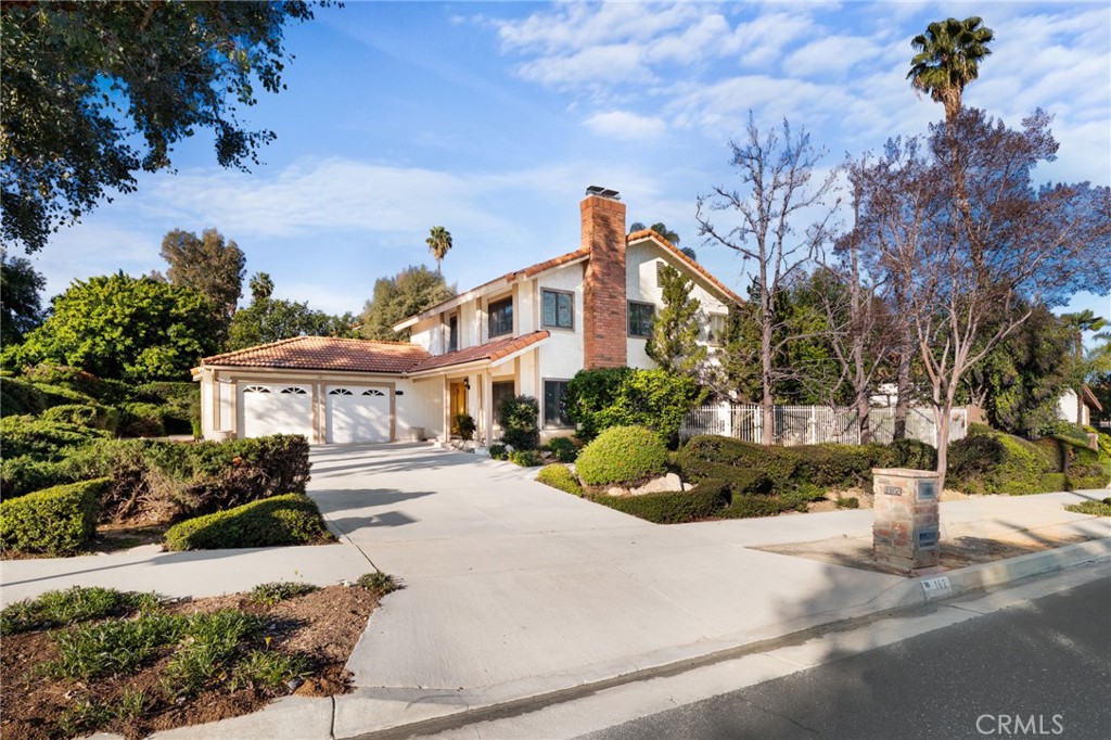 162 Lakeside Avenue Redlands, CA 92373 - Photo 2 of 32 a front view of a house with a yard and tree s