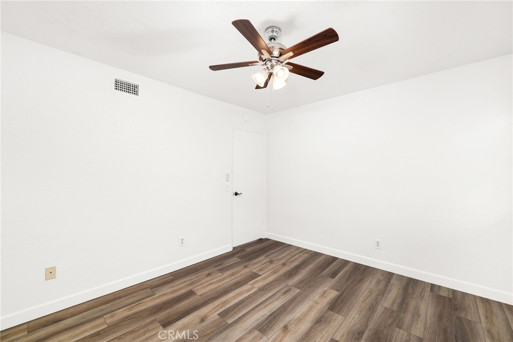 162 Lakeside Avenue Redlands, CA 92373 - Photo 21 of 32 a view of a big room with wooden floor and windows