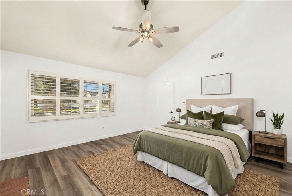 162 Lakeside Avenue Redlands, CA 92373 - Photo 24 of 32 a bedroom with a large bed and a window