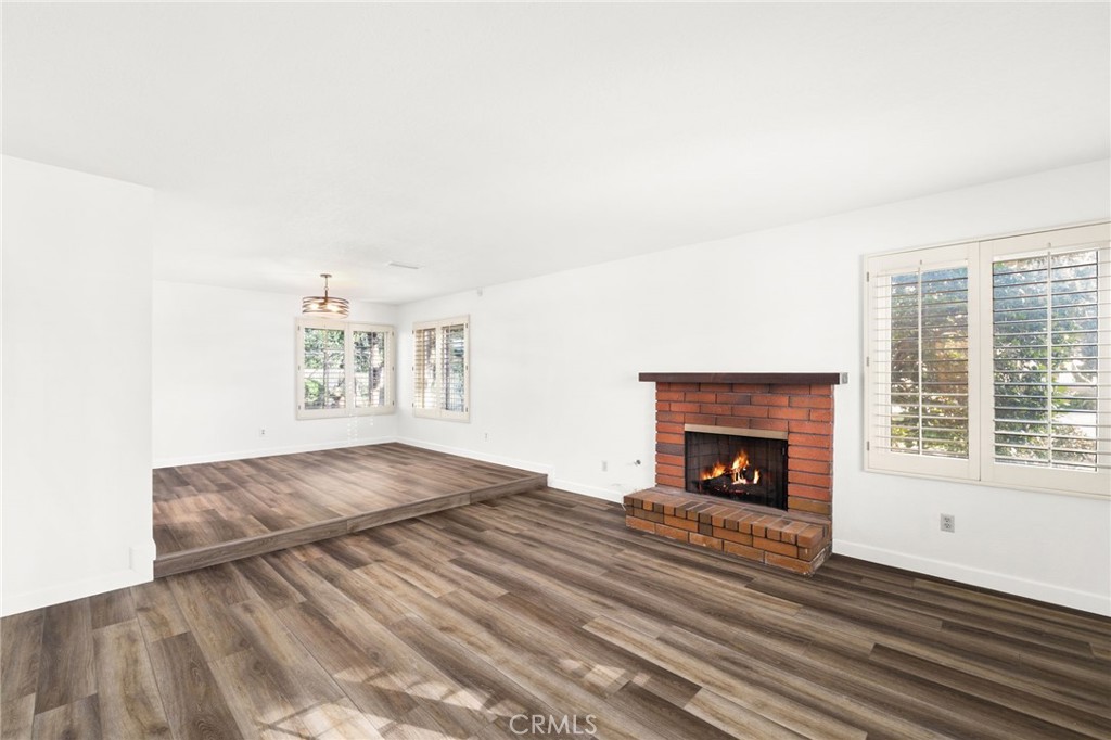 162 Lakeside Avenue Redlands, CA 92373 - Photo 4 of 32 a bedroom with a bed and a fireplace