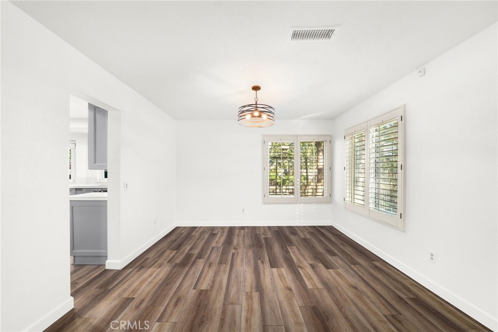 162 Lakeside Avenue Redlands, CA 92373 - Photo 6 of 32 a view of empty room with wooden floor and fan