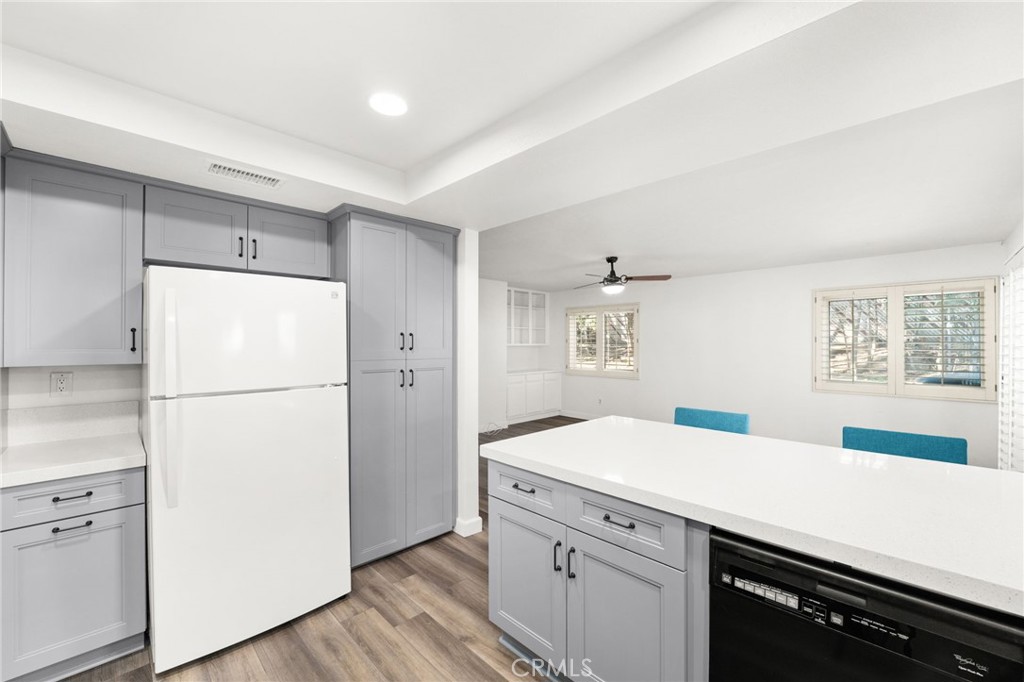 162 Lakeside Avenue Redlands, CA 92373 - Photo 9 of 32 a kitchen with a refrigerator and a sink