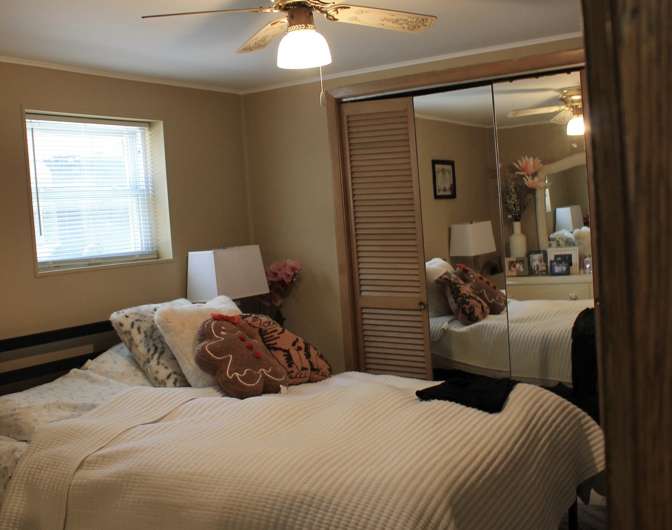 5325 West 53rd Place Chicago, IL 60638 - Photo 11 of 25 a bedroom with a bed and a chandelier