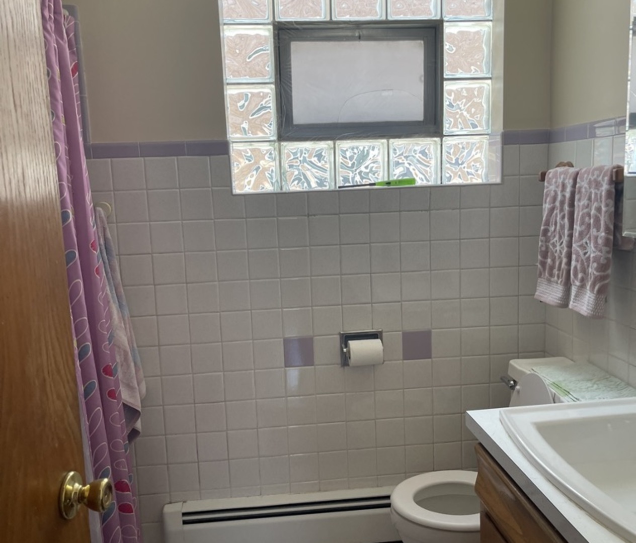 5325 West 53rd Place Chicago, IL 60638 - Photo 6 of 25 a bathroom with a toilet sink and mirror