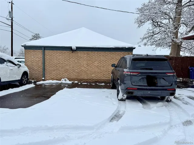 a front view of a house with parking