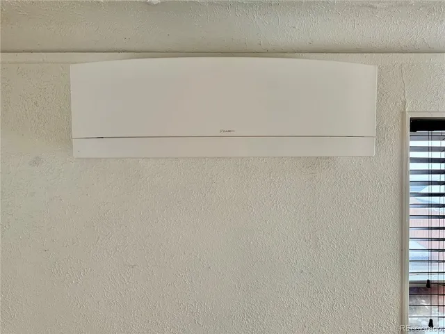 a view of a black and white wooden door