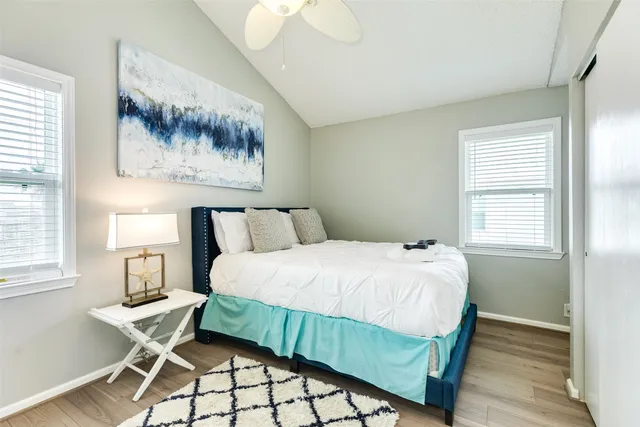 a bedroom with a bed and window