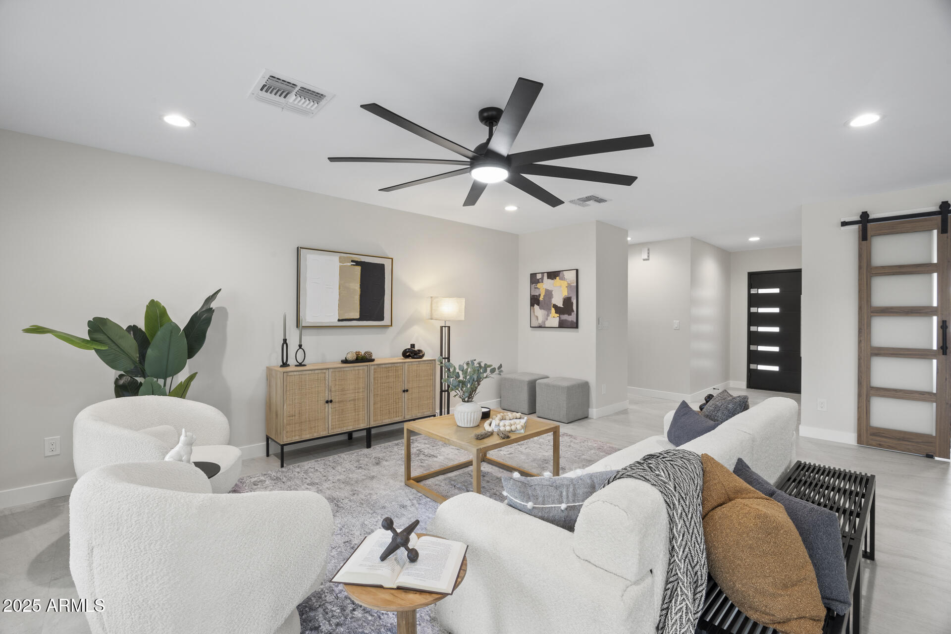 4059 East Cholla Street Phoenix, AZ 85028 - Photo 12 of 70 a living room with furniture a ceiling fan and a window