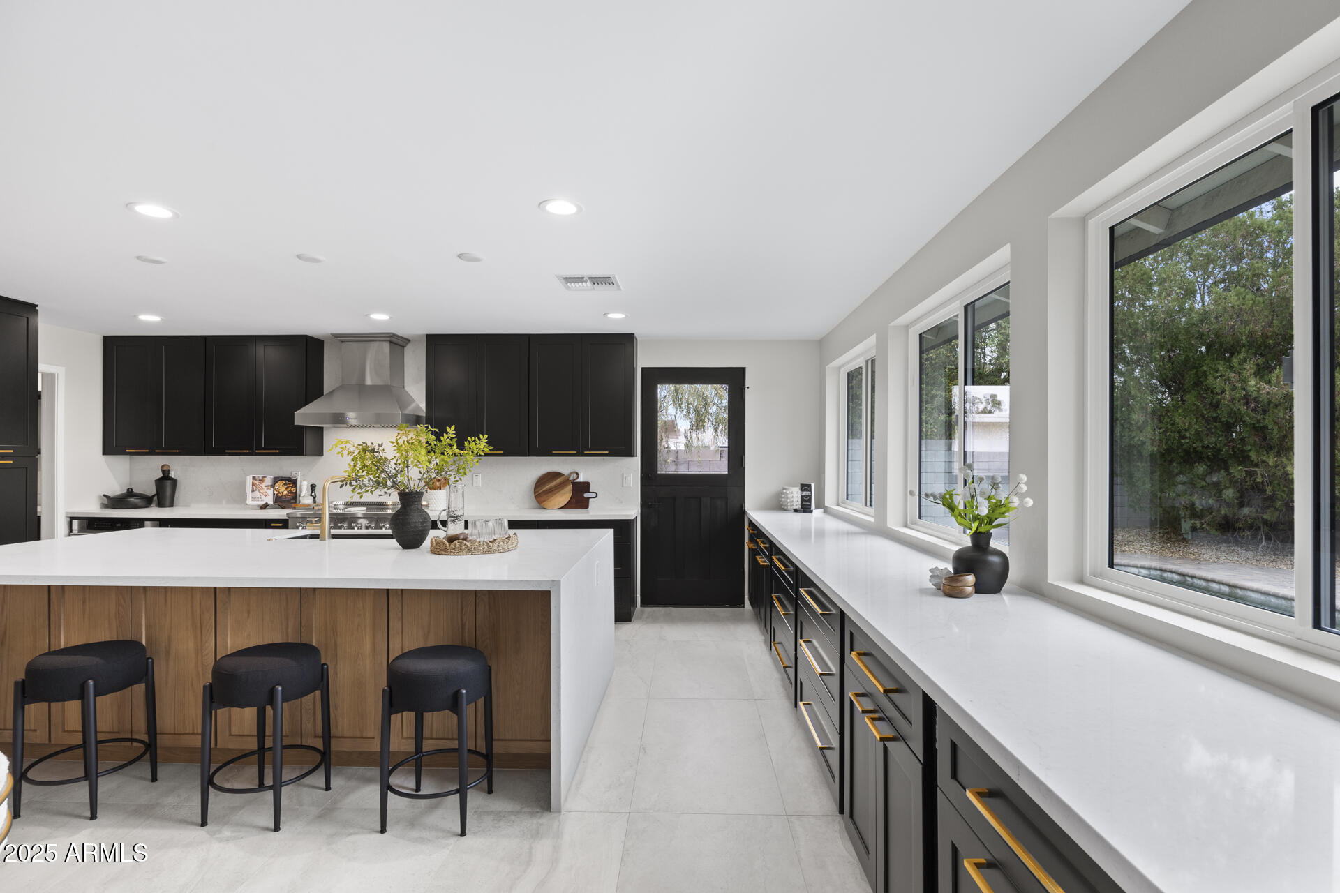 4059 East Cholla Street Phoenix, AZ 85028 - Photo 23 of 70 a kitchen with lots of counter top space and appliances