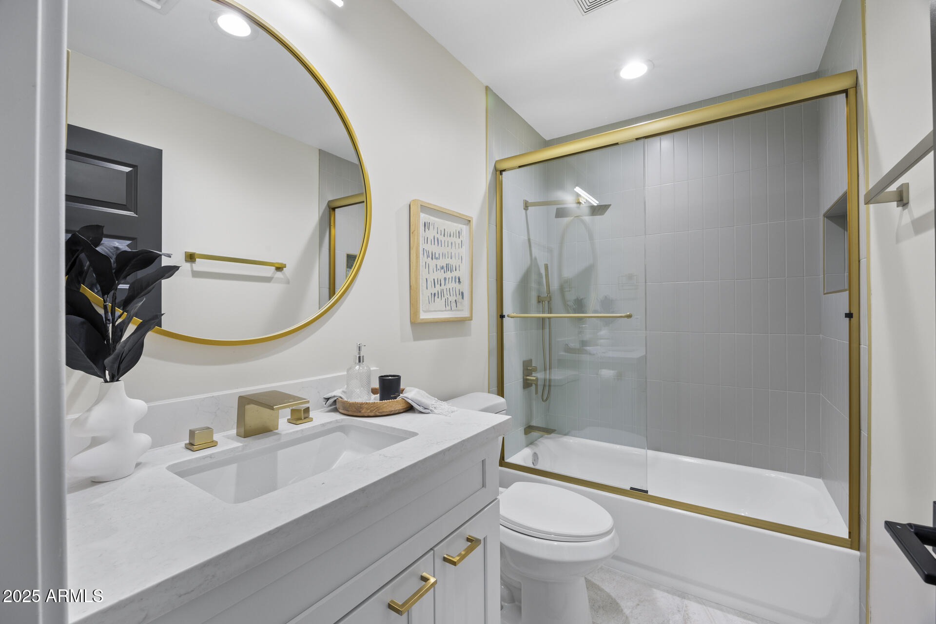 4059 East Cholla Street Phoenix, AZ 85028 - Photo 49 of 70 a bathroom with a sink a toilet and a mirror