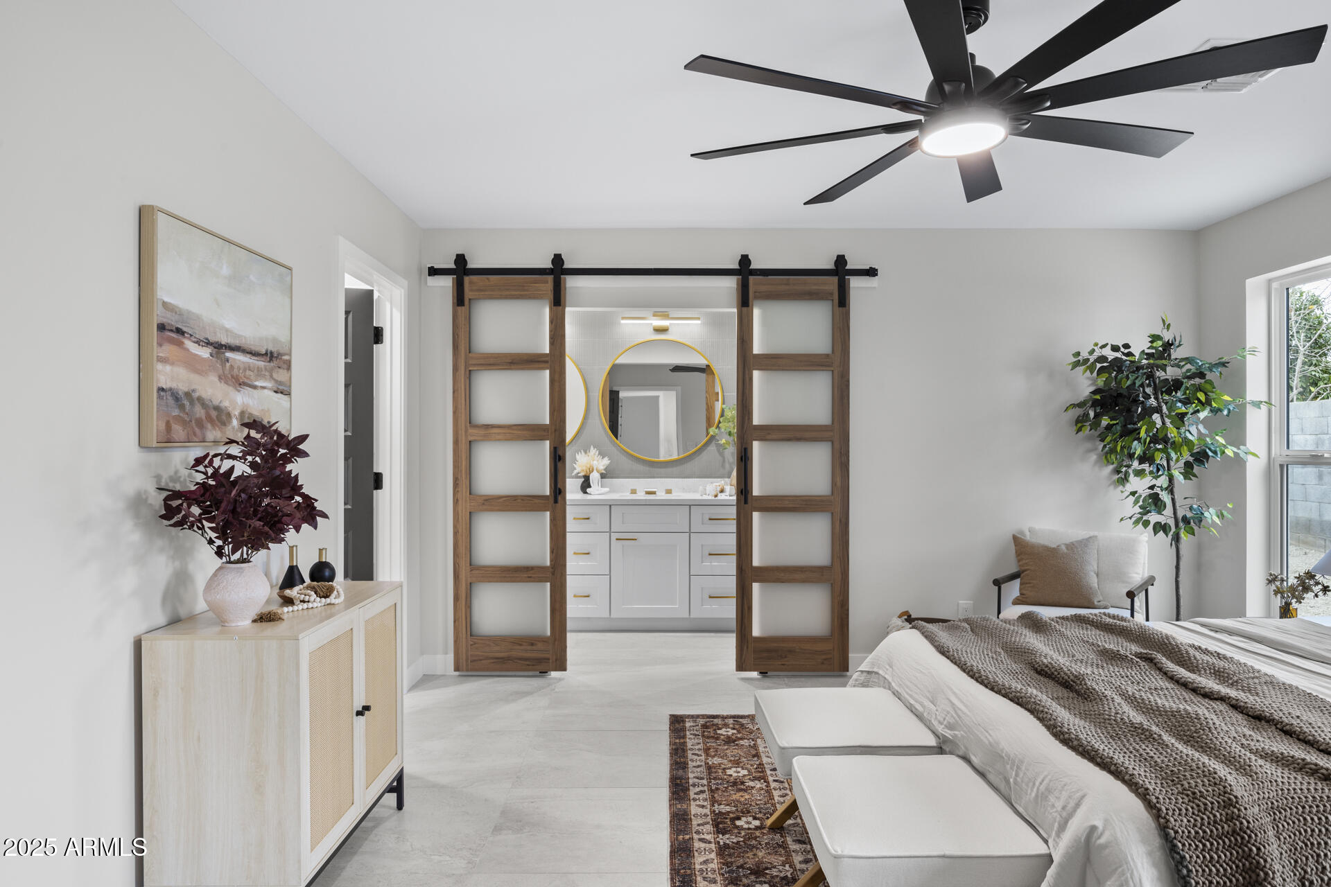 4059 East Cholla Street Phoenix, AZ 85028 - Photo 50 of 70 a bedroom with a large bed and a chandelier