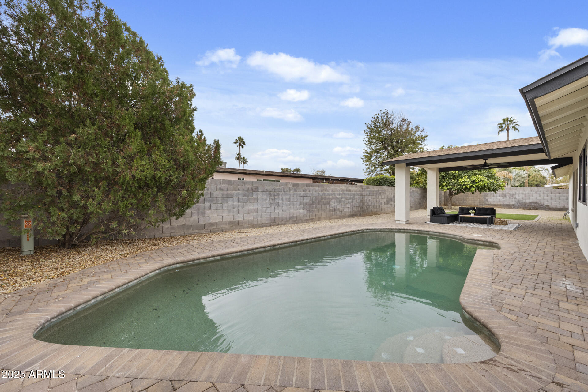 4059 East Cholla Street Phoenix, AZ 85028 - Photo 67 of 70 a view of a swimming pool with a patio
