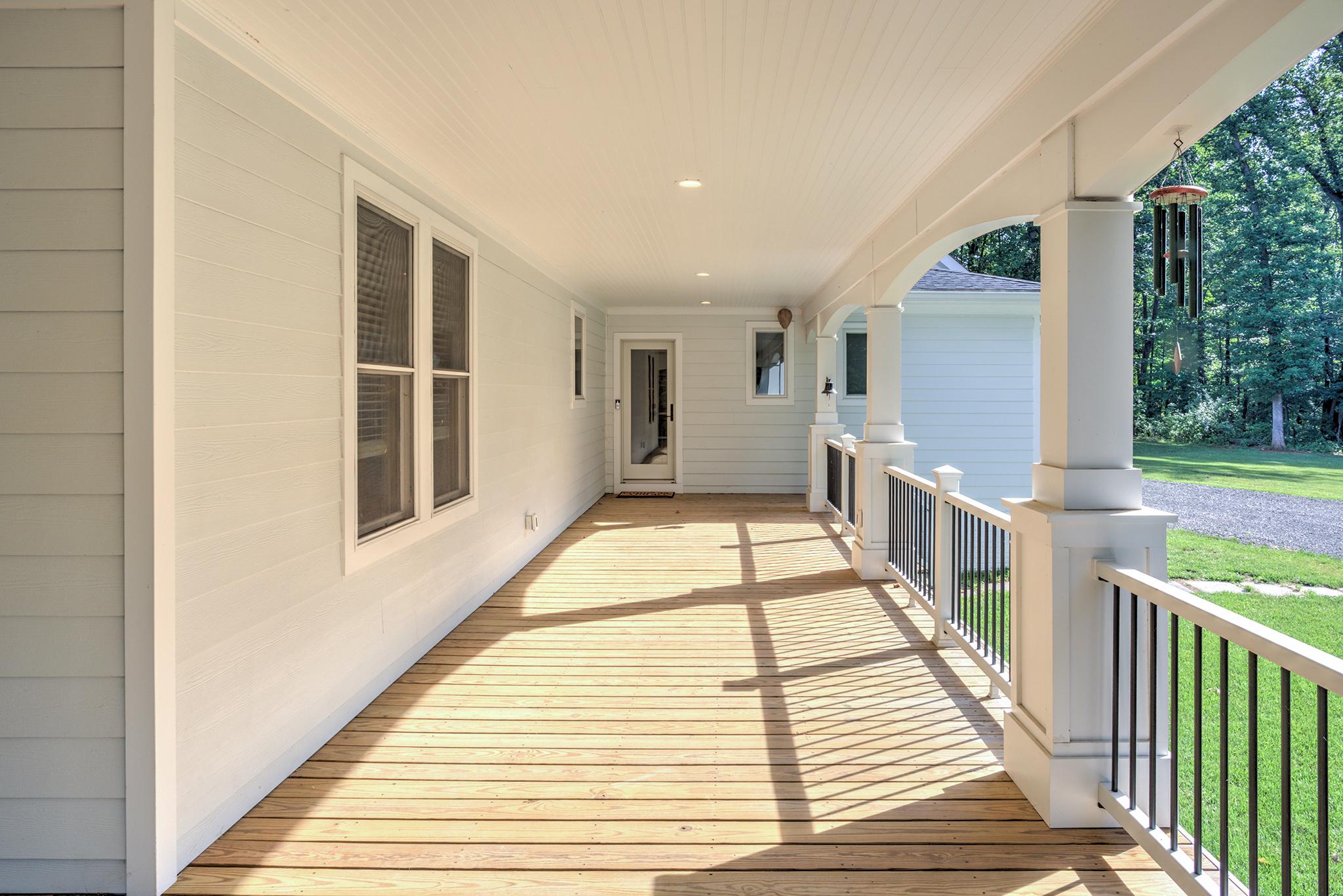 3411 Fenny Hill Road Delaplane, VA 20144 - Photo 65 of 75 Charming side wrap aound porch bathed in sunlight.