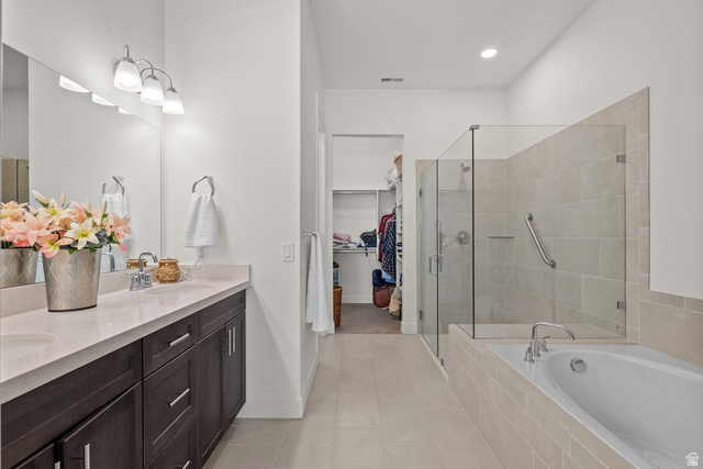 531 North Legend Way West, Unit D Mapleton, UT 84664 - Photo 17 of 42 Full bath featuring a spacious closet, double vanity, a garden tub, a stall shower, and light tile patterned floors