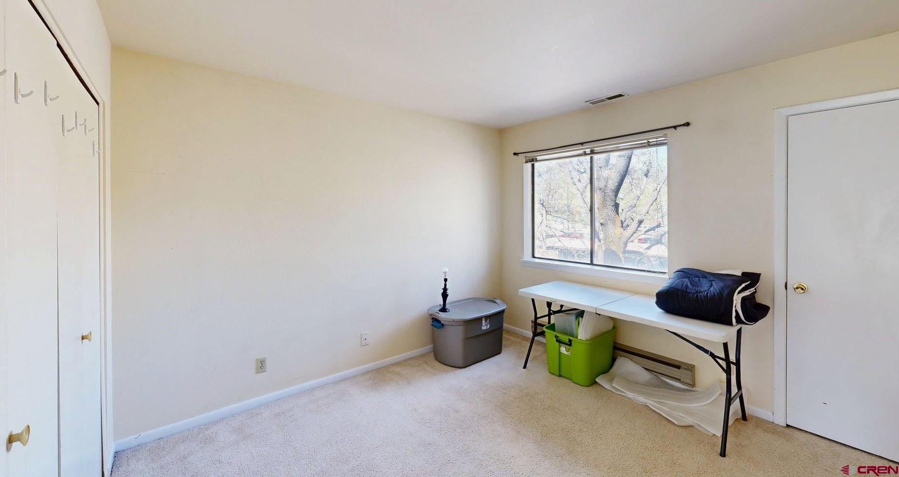 1200 Florida Road, Unit 52 Durango, CO 81301 - Photo 13 of 29 a room with lots of white furniture and a window